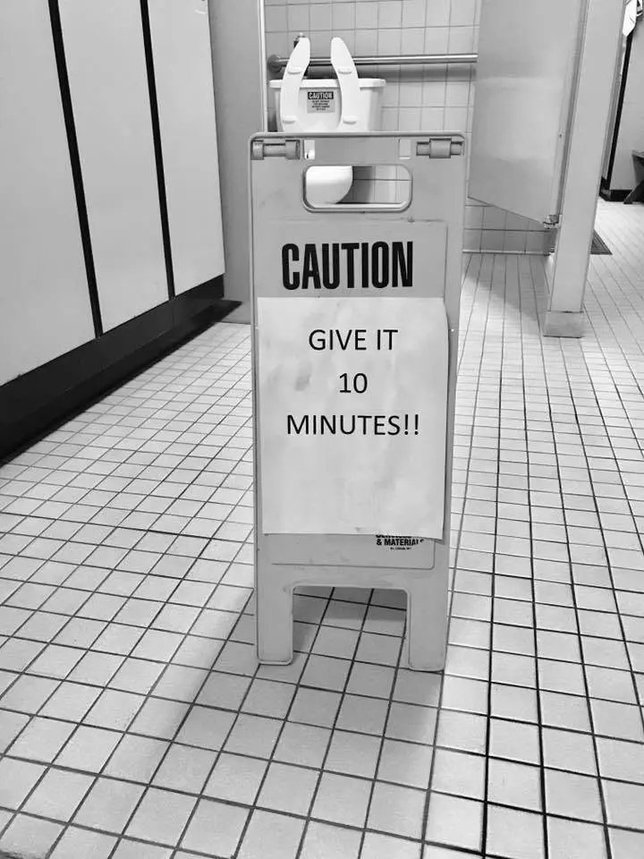 Caution sign placed while a freshly cleaned floor dries
